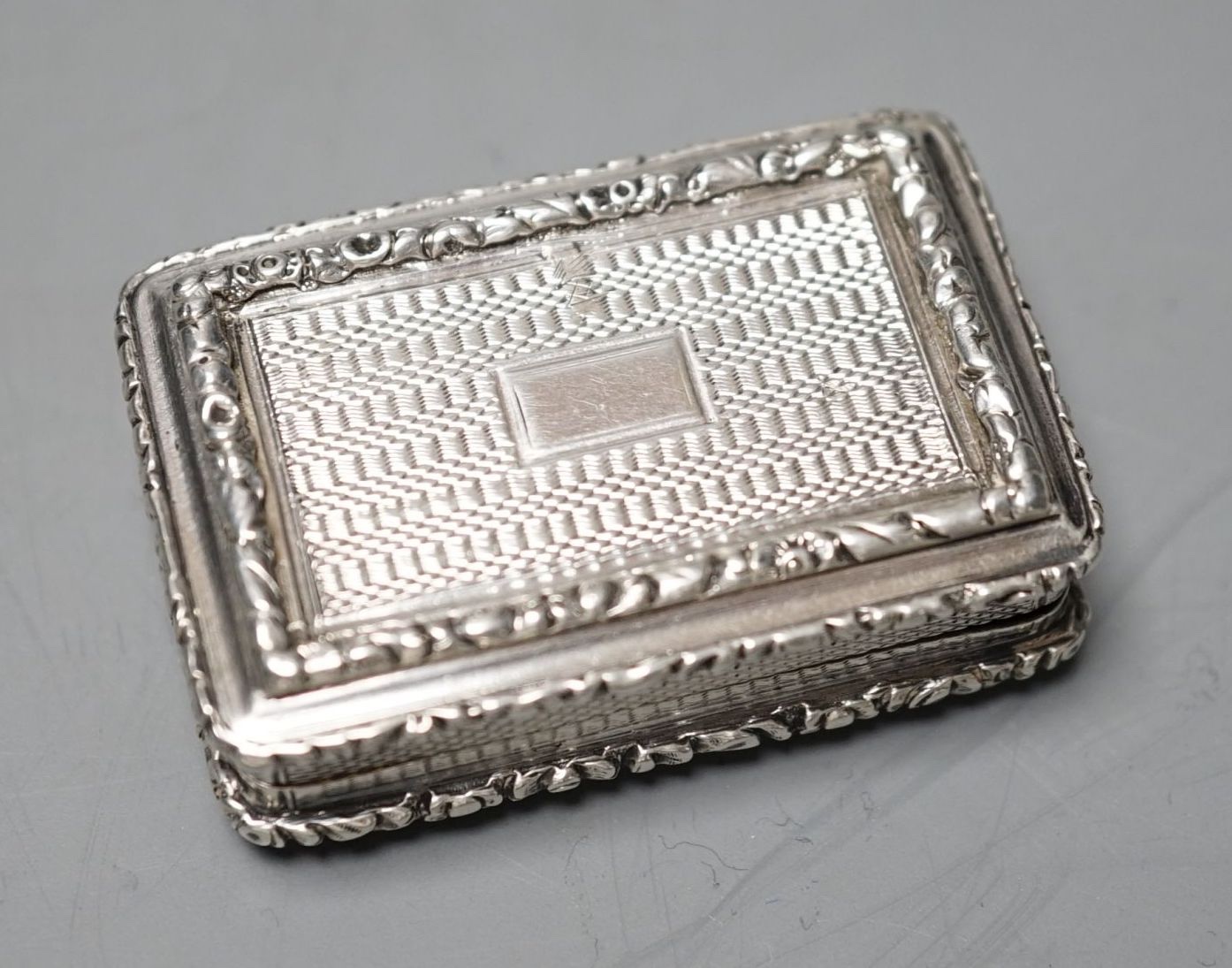 A George IV engine turned silver rectangular vinaigrette, John Thropp, Birmingham, 1826, 44mm.
